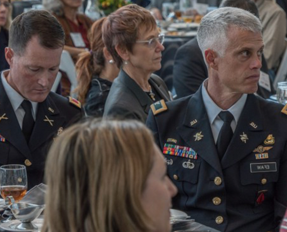 Veterans attend an event at the University of Denver in their honor.